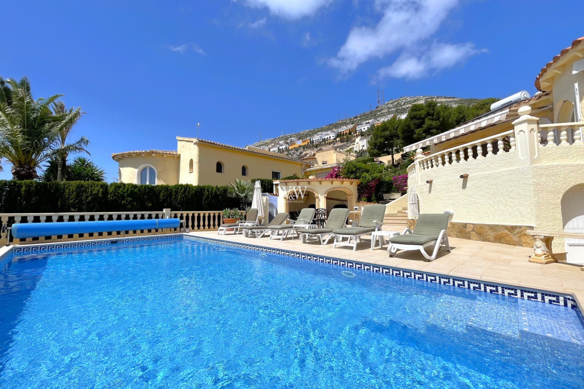 Across pool to terrace and BBQ area