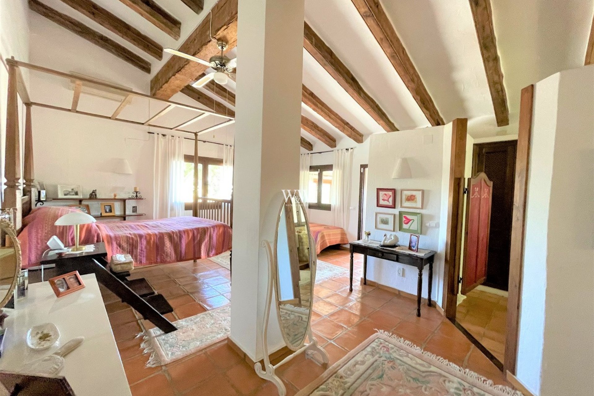 Bright double bedroom with beams