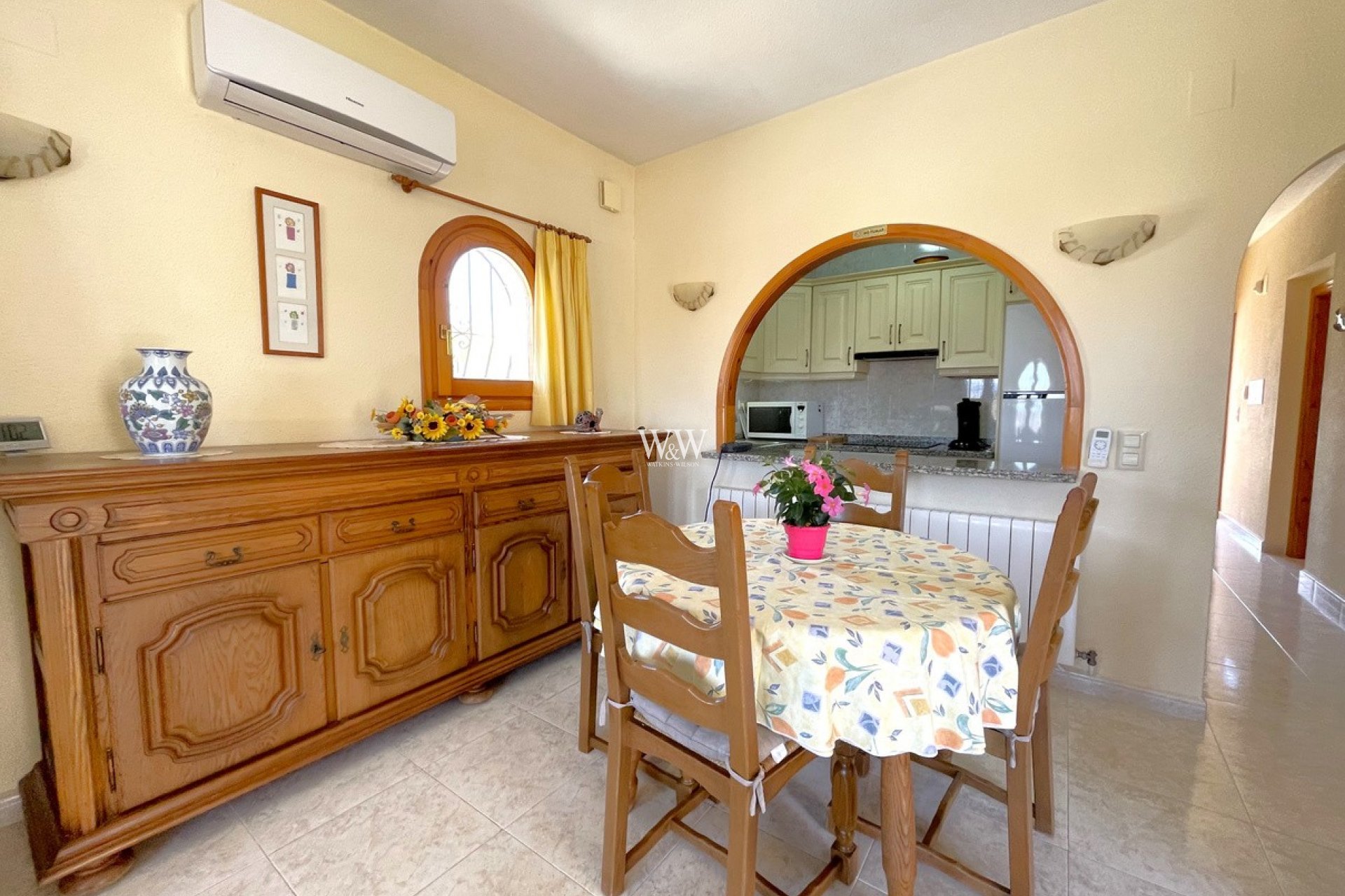 Dining room with arch to kitchen