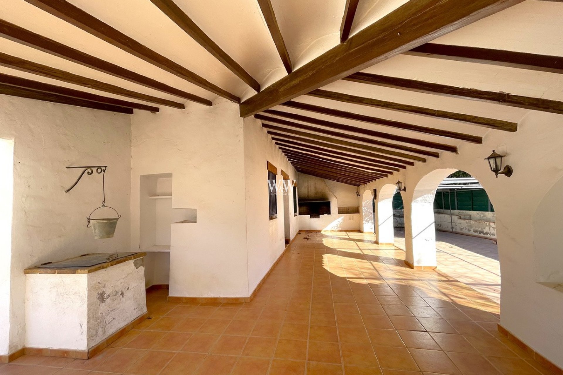 Large covered terrace with beamed roof