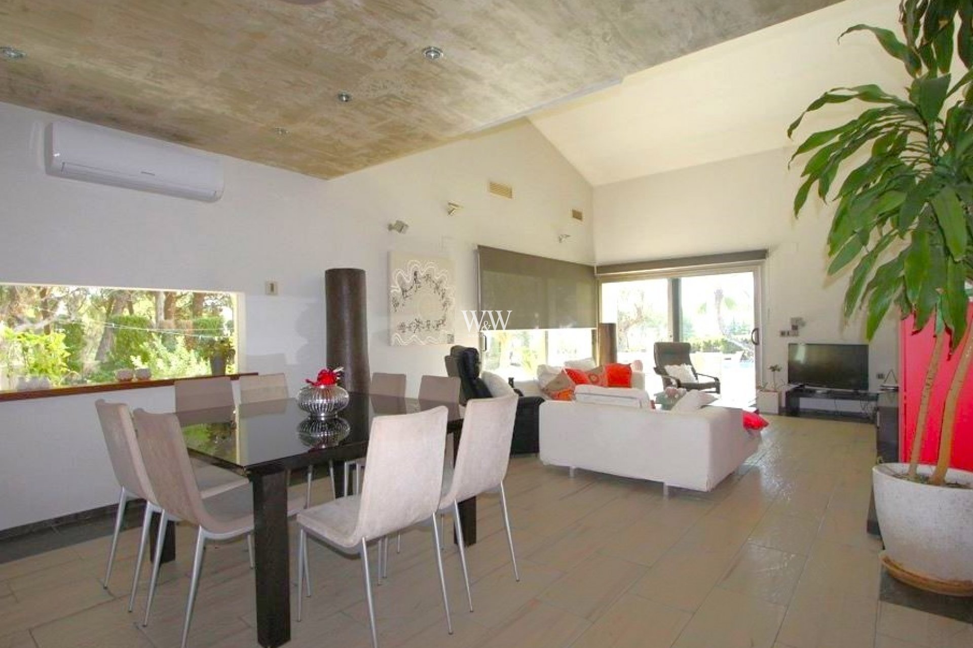 Open plan living area with high ceiling