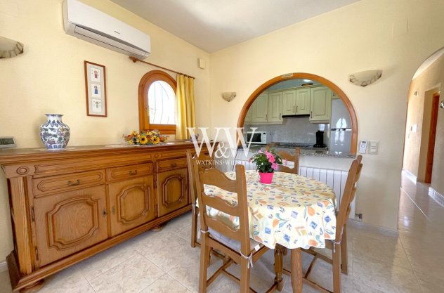 Dining room with arch to kitchen