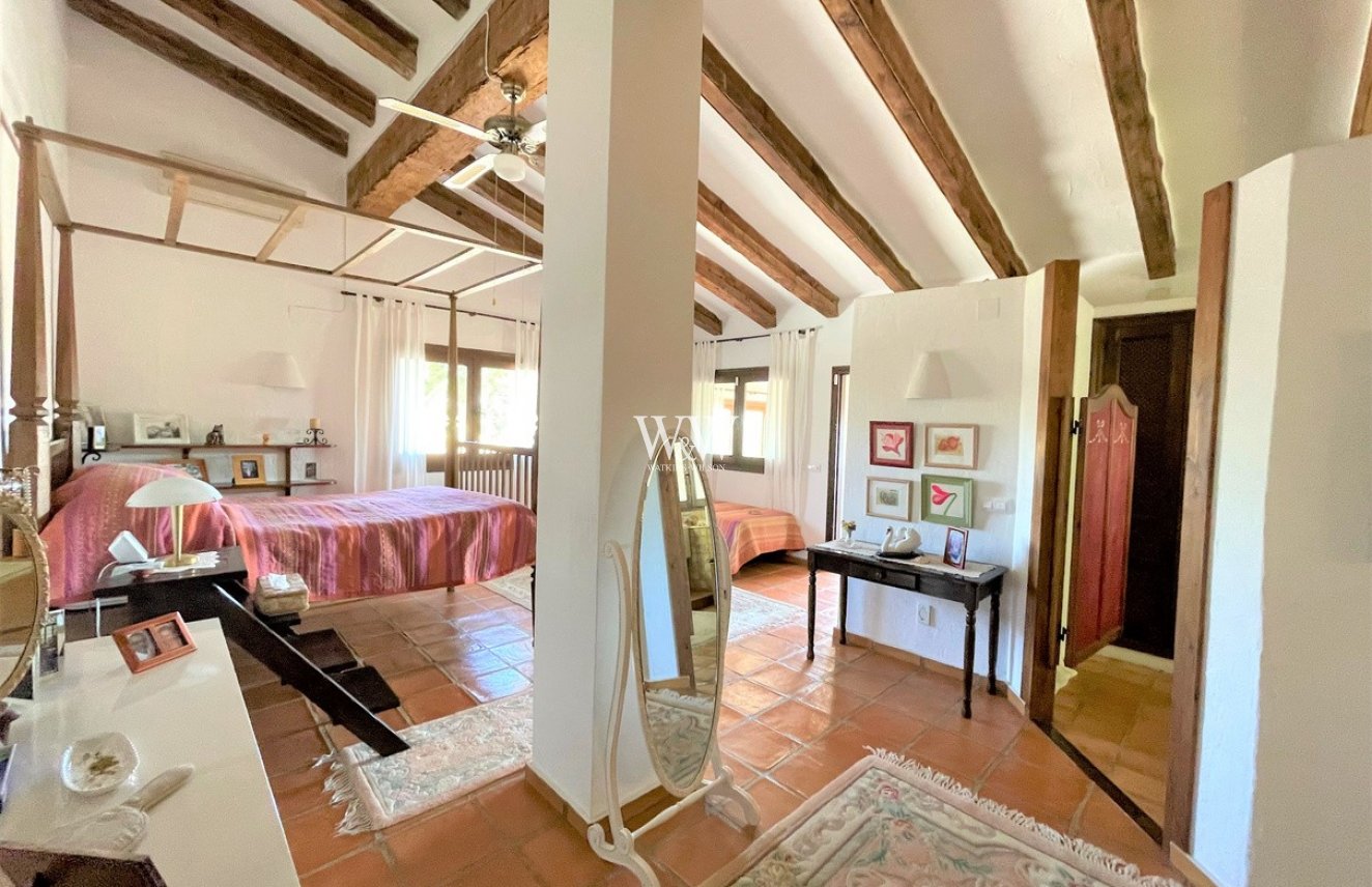 Bright double bedroom with beams