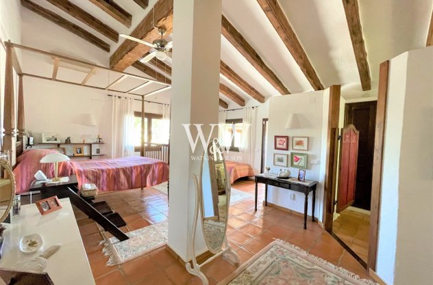 Bright double bedroom with beams