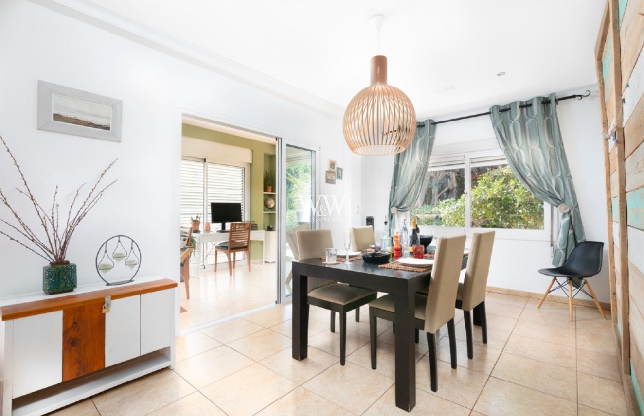 The dining room with sliding door to the lounge and open to the kitchen